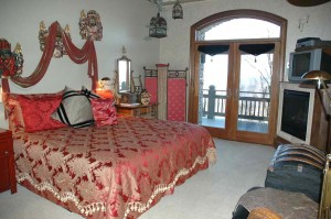 Casablanca- King Bed or Two Twin Beds, Fireplace, and a Flat Screen TV with a DVD/VCR Player. Double French Doors going out onto a private sitting area with two Swivel Rockers and Footstools.