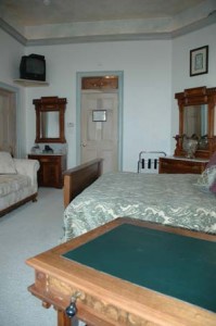 Key Largo- King Bed w/ a Pillow Top, Small TV with a VCR Player, Desk and Loveseat